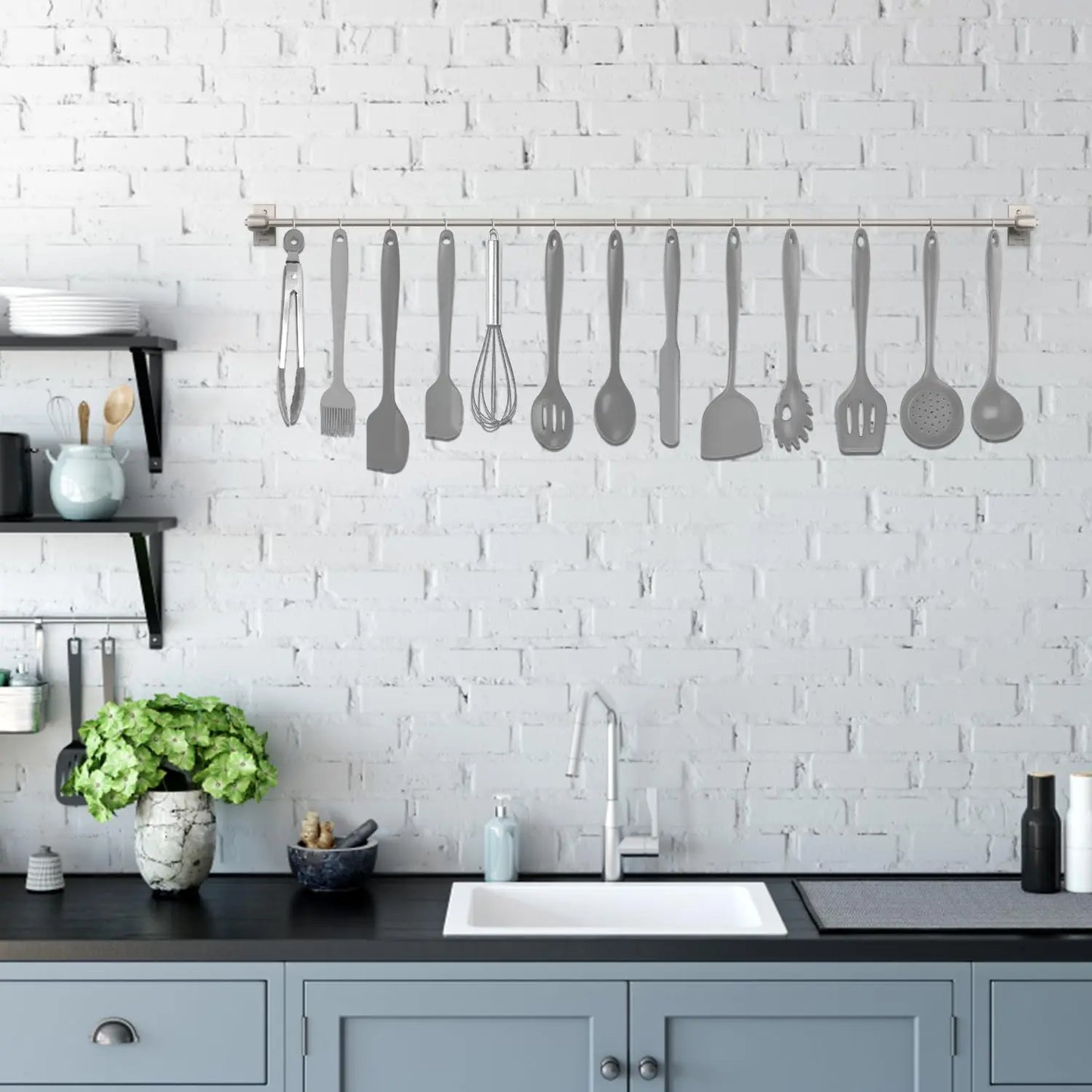 Grey kitchen utensils with red crab holder in use in a clean kitchen setup