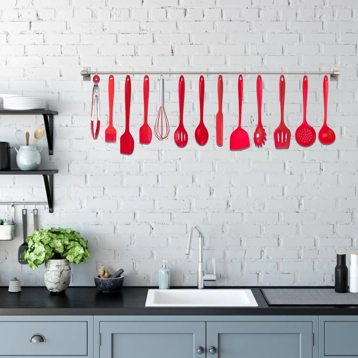 Red utensils with crab holder in use in a clean, modern kitchen scene