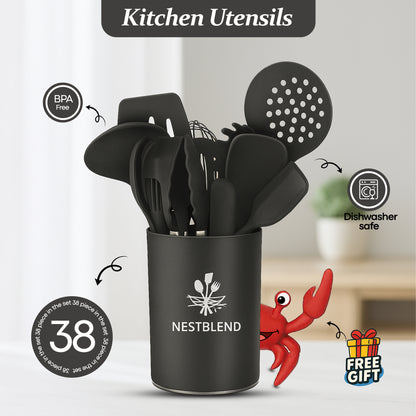 Black silicone kitchen utensils set displayed with red crab spoon holder on white background