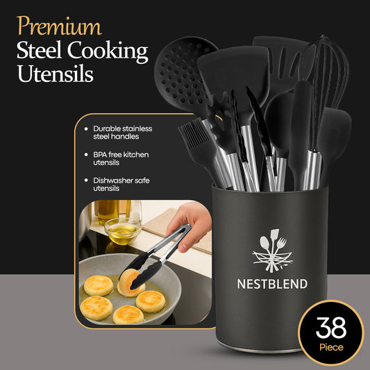 Black steel spoons and spatulas standing upright in crab spoon holder

